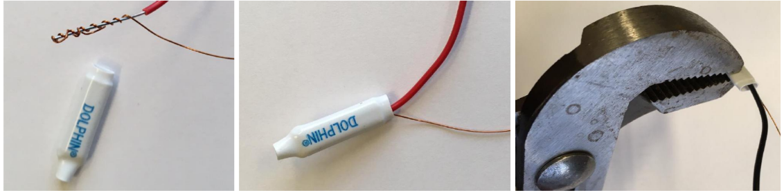 Using pliers to crimp the wires together with the Dolphin connector