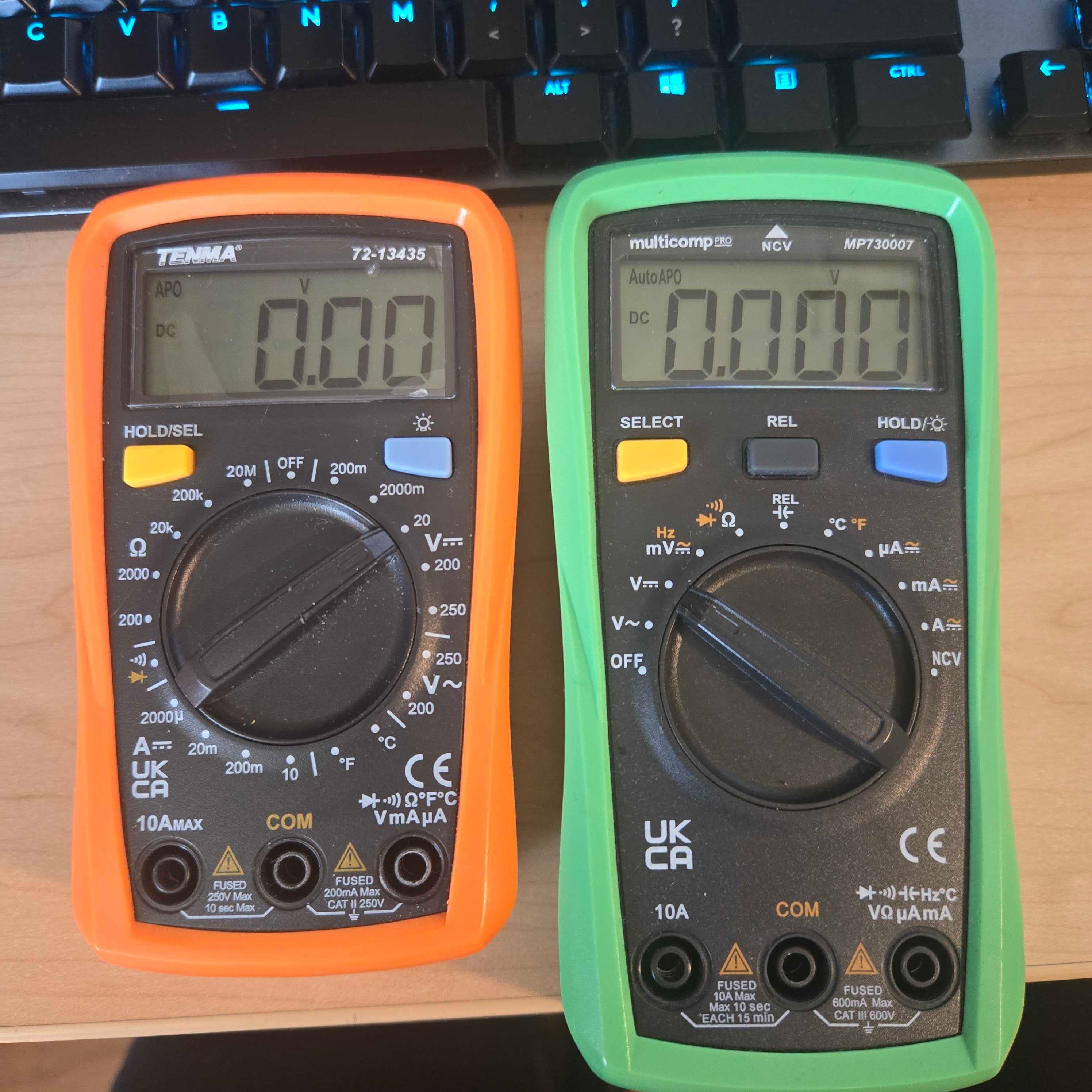 Two models of multimeter set to measure voltage